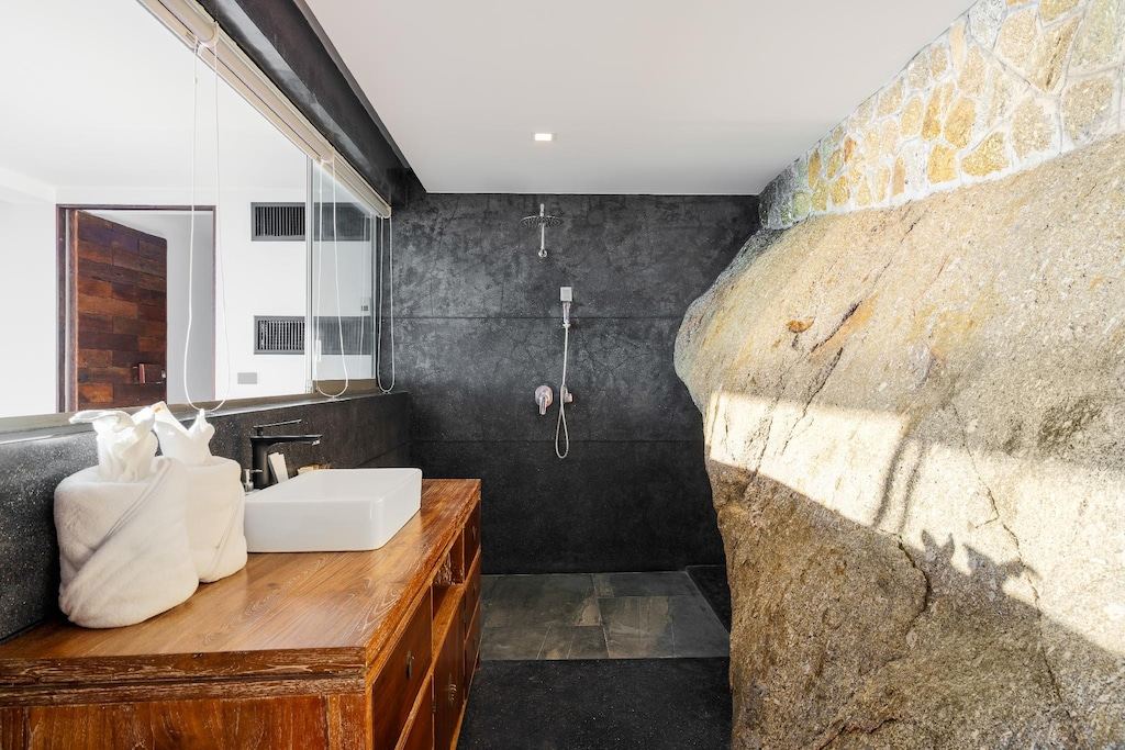 Villa 369 stone bathtub with floor-to-ceiling ocean view window, luxury Samui bathroom